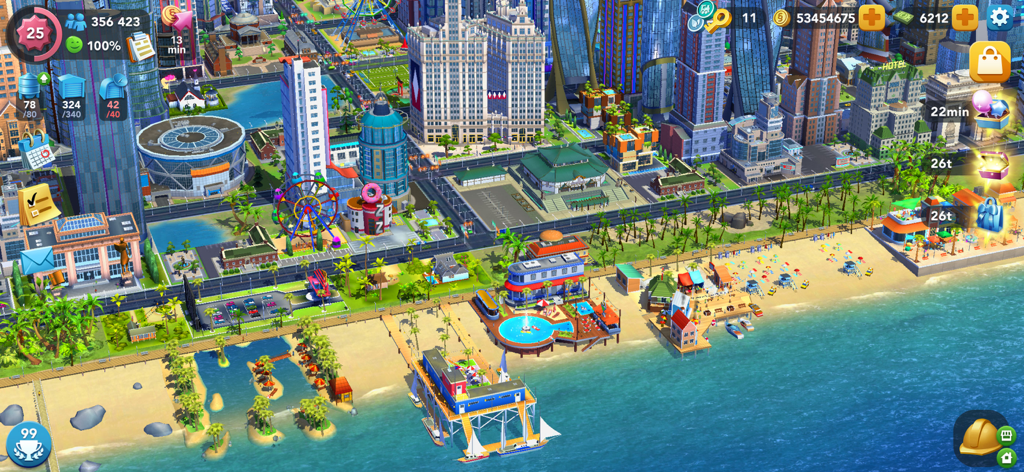 SimCity BuildIt - Una vista dall'alto di una vibrante città costiera con grattacieli e una spiaggia in SimCity BuildIt