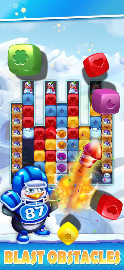 Jugabilidad de Penguin Pals Arctic Rescue mostrando un tablero de puzzle con bloques coloridos y una explosión de propulsor de cohete