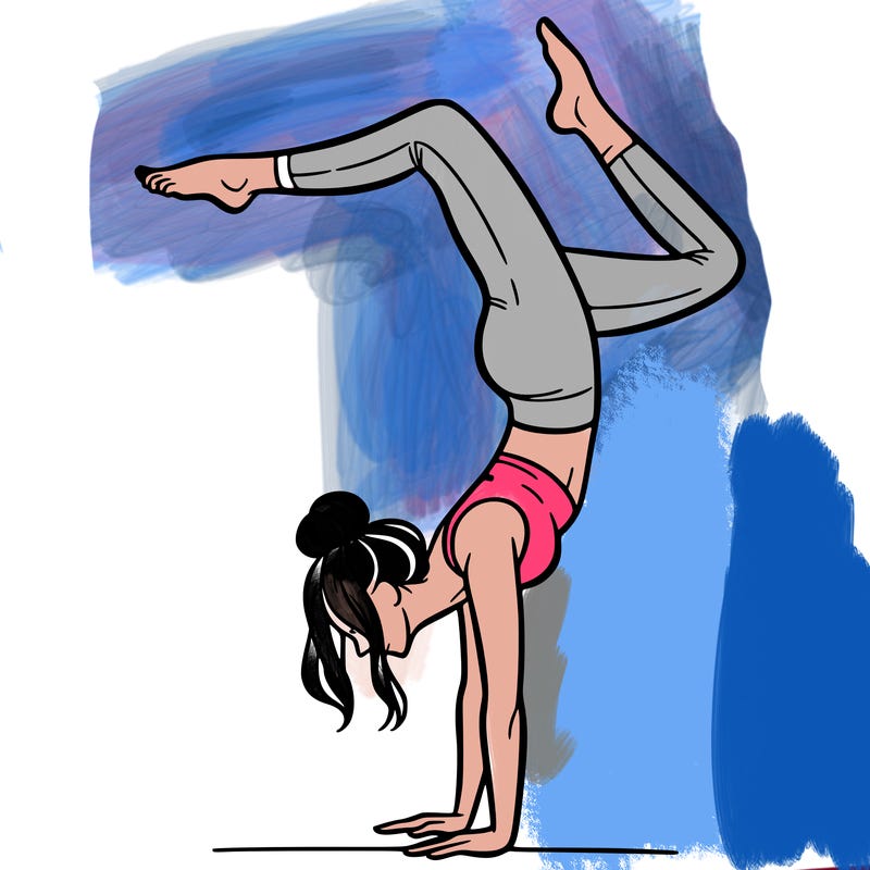 a woman doing a handstand