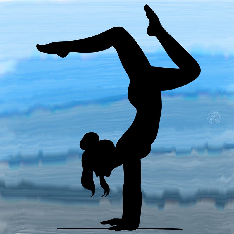 a woman doing a handstand
