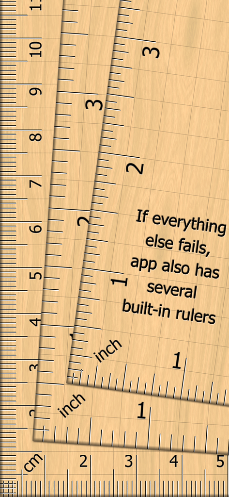 Varias reglas digitales incorporadas con marcas en pulgadas y centímetros sobre un fondo de veta de madera