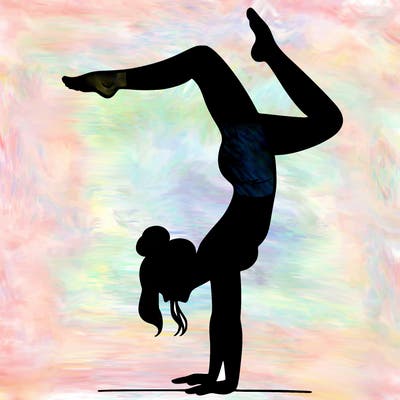 a woman doing a handstand