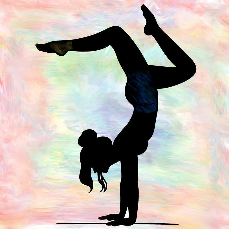 a woman doing a handstand