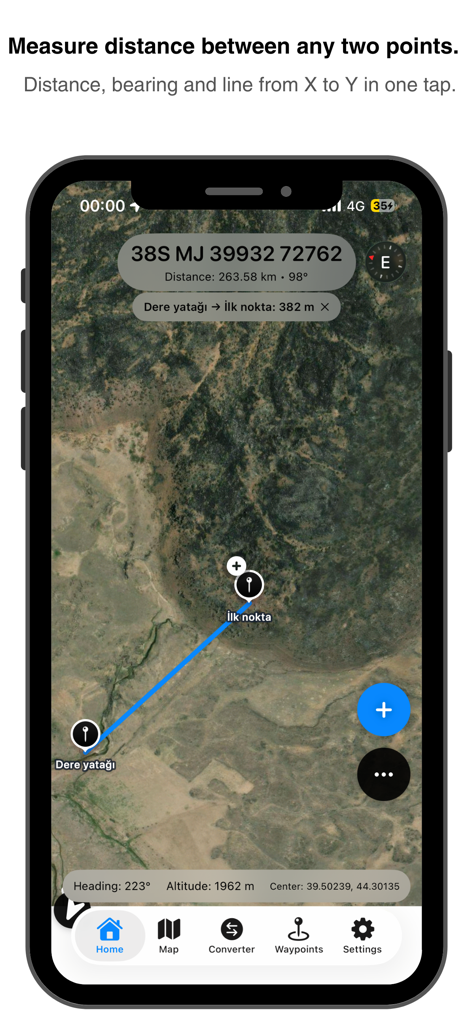 Satellite map view showing a blue line measuring distance and bearing between two tactical waypoints in the MGRS GPS Mapper app.