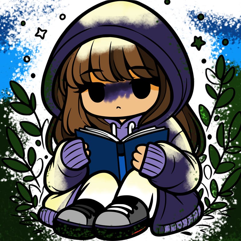 girl in oversized hoodie reading a book