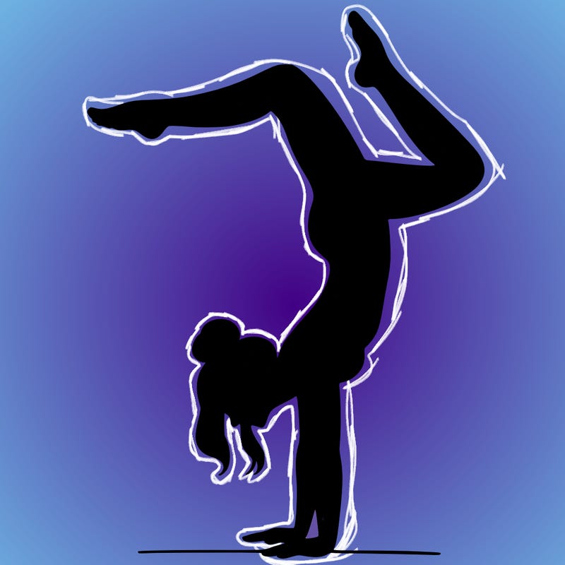 a woman doing a handstand