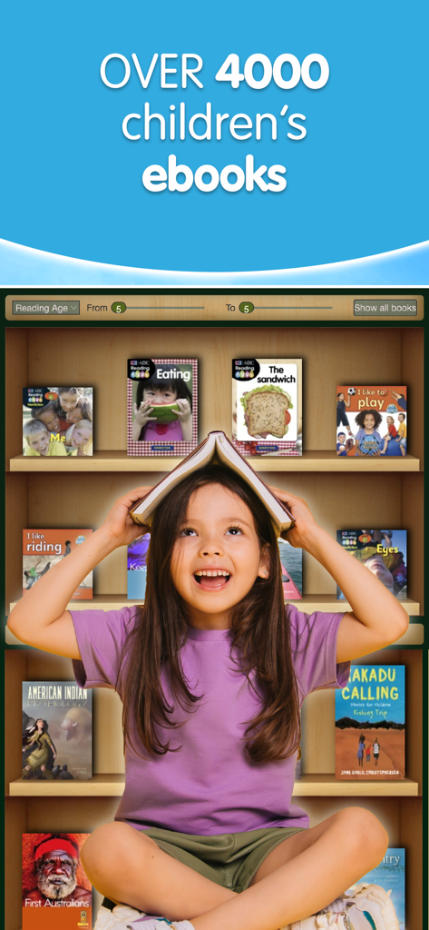 A happy young girl with a book on her head sitting in front of a digital bookshelf with over 4000 childrens ebooks