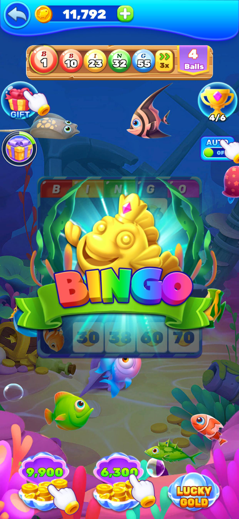 A golden fish wearing a crown celebrates a bingo victory in a colorful underwater scene