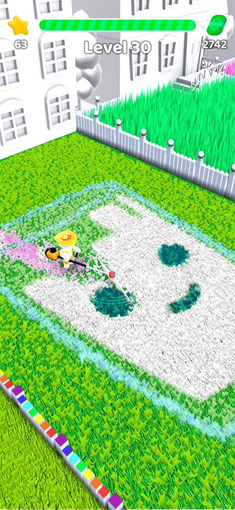 Gameplay of Mow My Lawn showing a character cutting grass to reveal a smiley face pattern