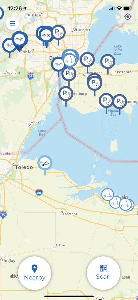 A map view in the Movatic app showing icons for available bikes, scooters, and parking spots in an urban area