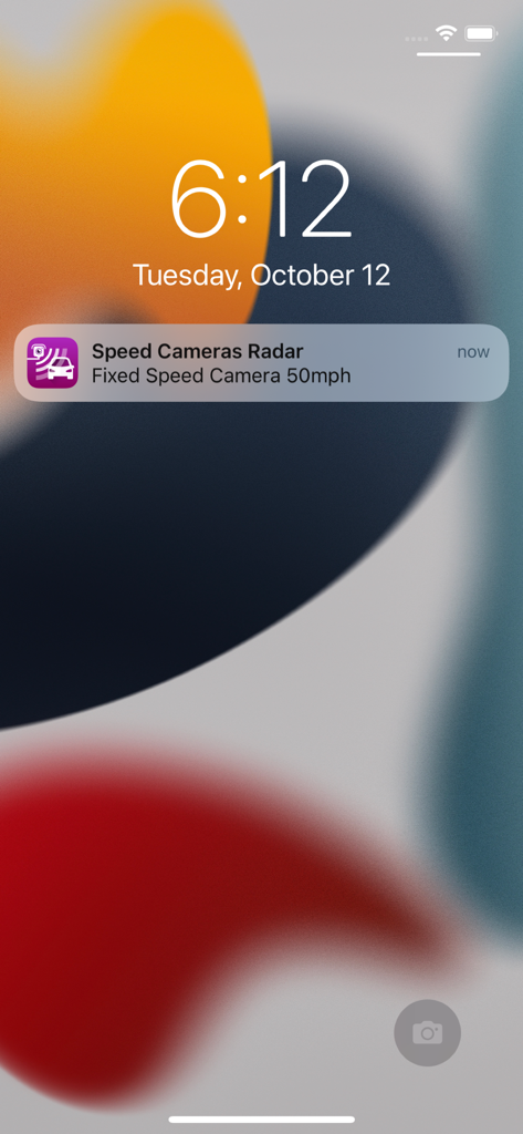 iOS lock screen displaying a real time fixed speed camera alert notification from the Speed Cameras Radar app