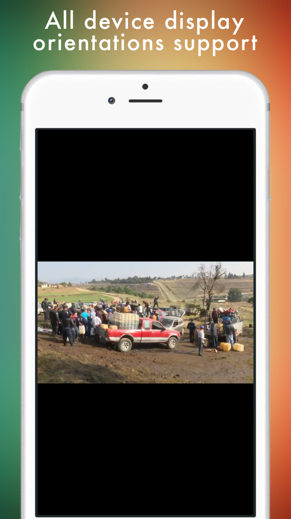 Screenshot of TV Mexicana app on iPhone displaying a live news broadcast in landscape orientation