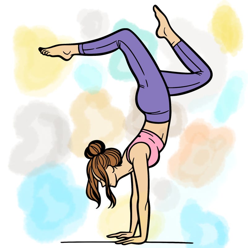 a woman doing a handstand