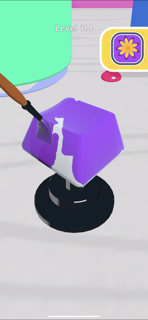 A player using a brush to paint a 3D keycap purple in the Keyboard Art app