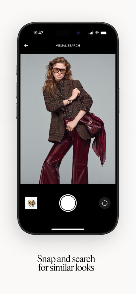 HM app visual search screen showing a model and camera interface to find similar fashion items