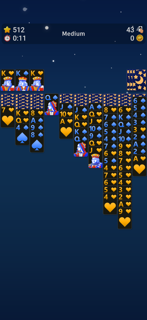 Spider Solitaire` - A Spider Solitaire game in progress featuring a starry night background and medium difficulty setting.