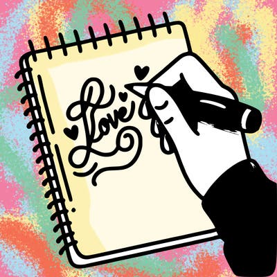 a hand writing “love” in calligraphy on a notebook