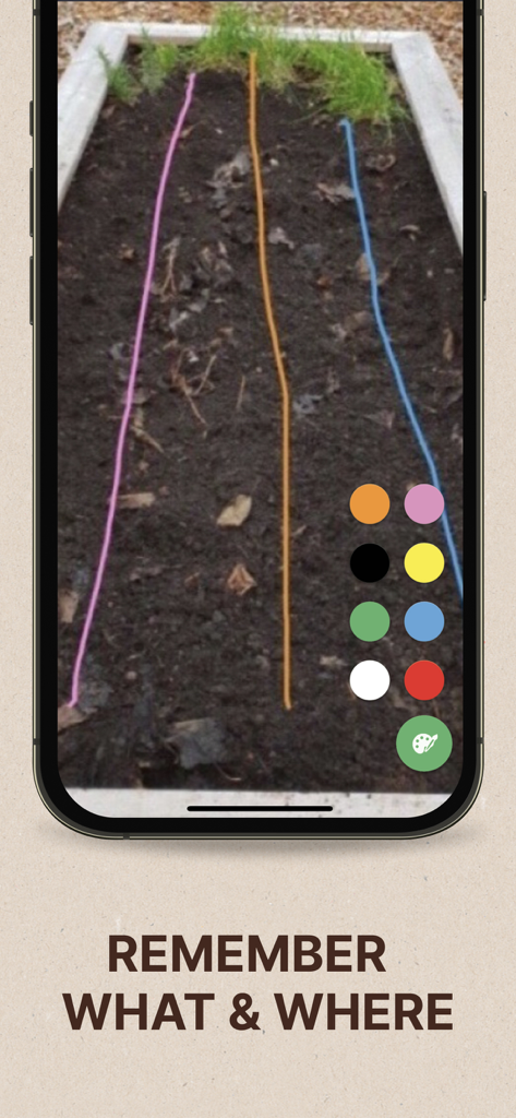 GARDENIZE Plant Care Gardening - A smartphone screen showing colored lines drawn over a garden bed image in the Gardenize app to mark planting areas.