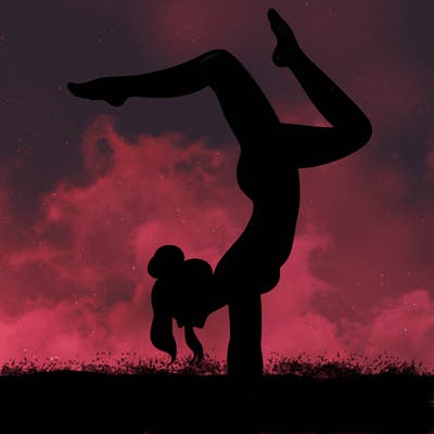 a woman doing a handstand