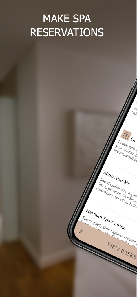 Hayman Island - 헤이만 섬 럭셔리 리조트 모바일 앱에서 스파 예약 옵션을 보여주는 스마트폰 화면.