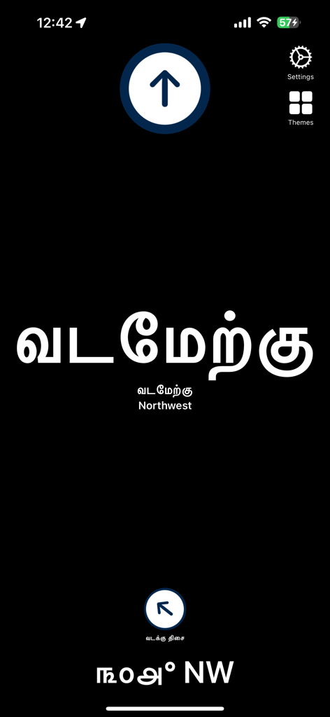 A mobile app screen for Tamil Directions Compass showing the direction Northwest with large Tamil text and English translation on a dark background