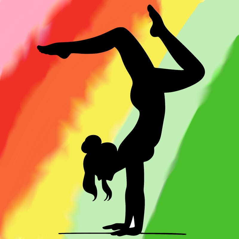 a woman doing a handstand