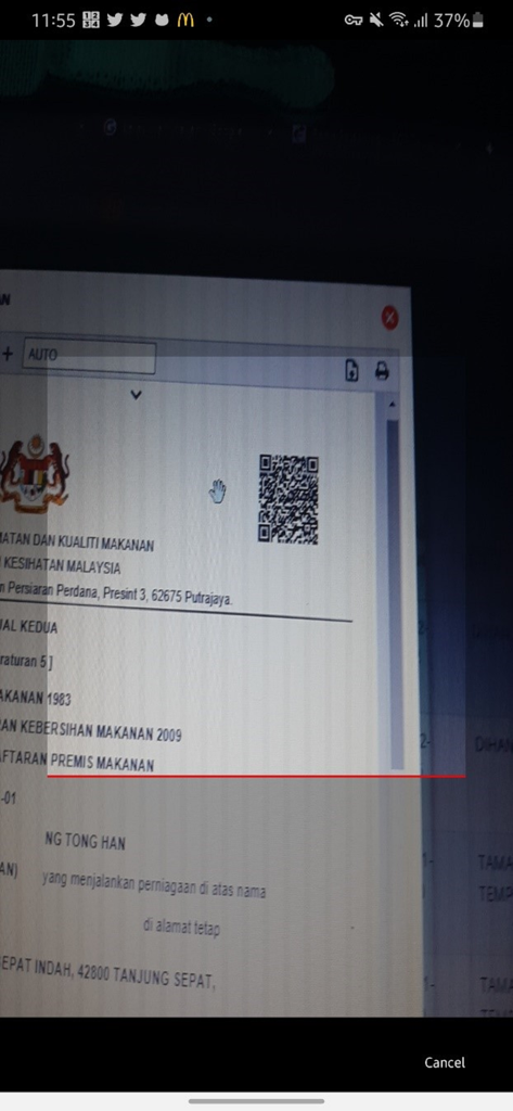 FoSIM Public Apps - Smartphone interface scanning a QR code on a Malaysian food safety license document