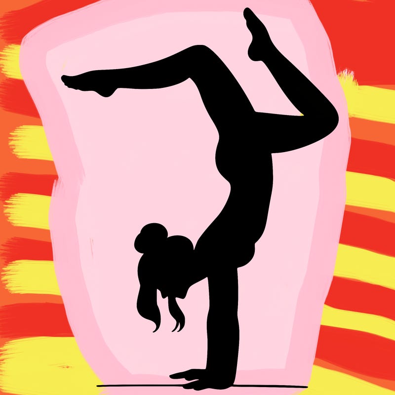 a woman doing a handstand