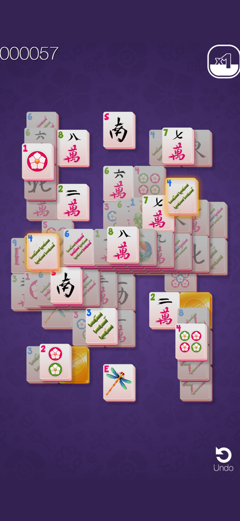 Uno screenshot di gioco di Gold Mahjong FRVR che mostra tessere Mahjong che vengono abbinate su sfondo viola.