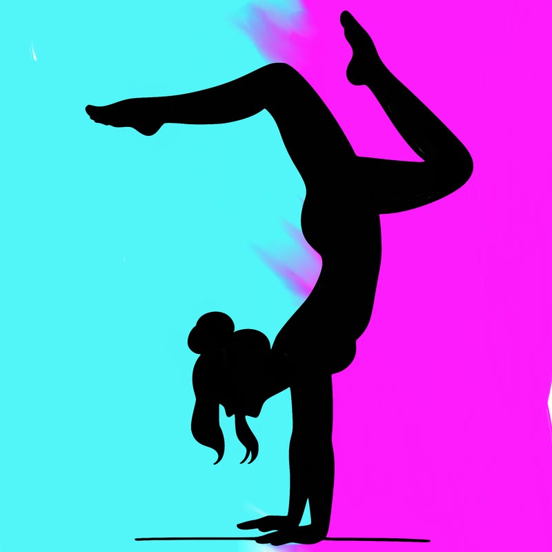 a woman doing a handstand