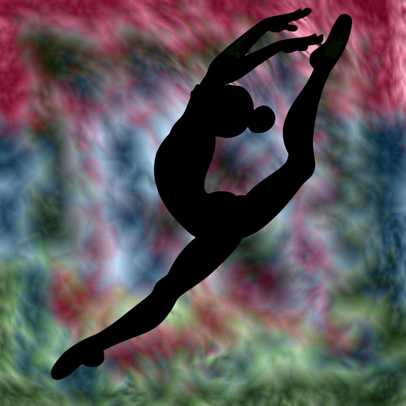 gymnast doing a leap in a leotard with a bent back leg