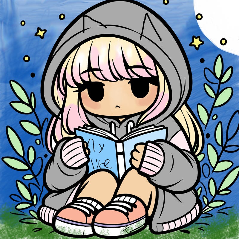 girl in oversized hoodie reading a book