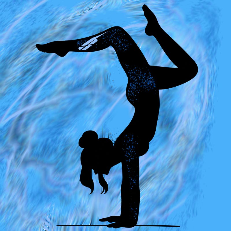 a woman doing a handstand