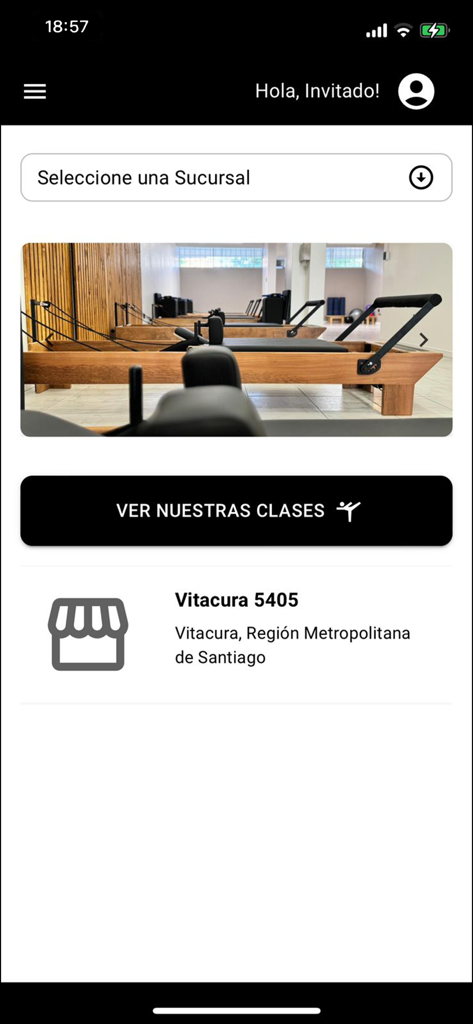 Espacio Pilates - Espacio Pilates mobile app home screen showing a pilates reformer studio and branch location selection for Vitacura
