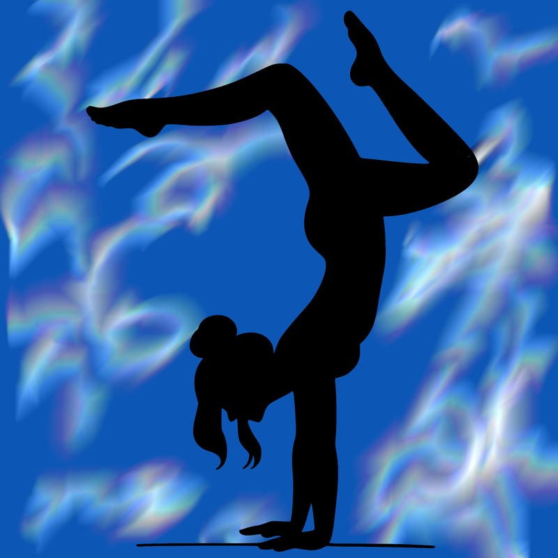 a woman doing a handstand
