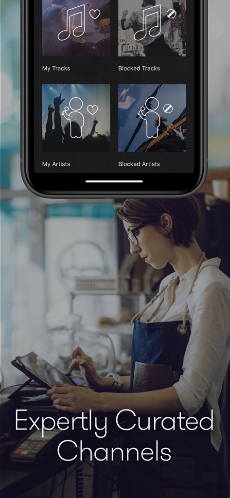 Barista using the Stingray Music for Business app to control curated music channels in a cafe