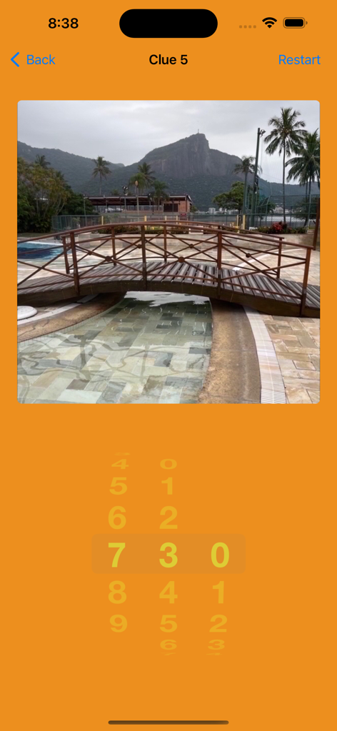 Treasure Hunt By Photos - A photo clue of a wooden bridge in a scavenger hunt app with a number selection wheel