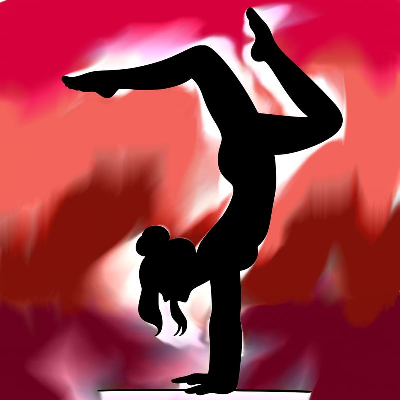 a woman doing a handstand