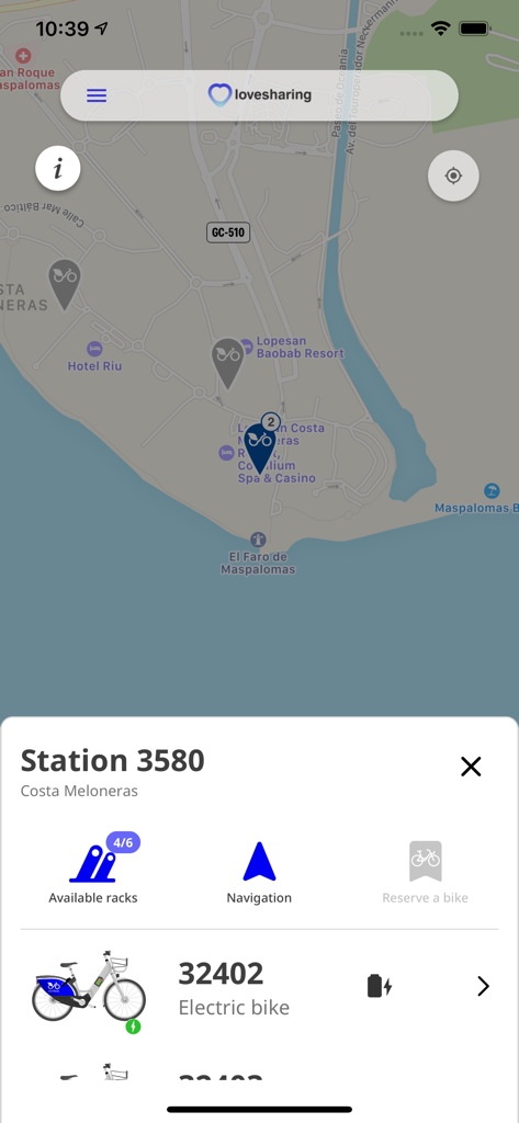 Screenshot of the Lovesharing bikes app showing available electric bikes and station locations on a map in the Canary Islands.