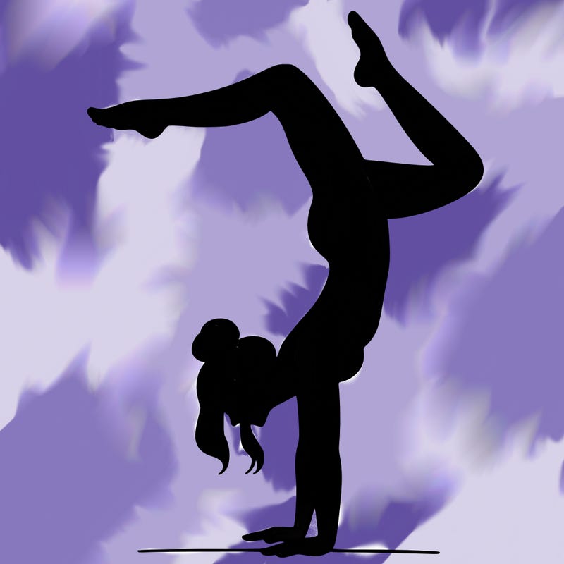 a woman doing a handstand