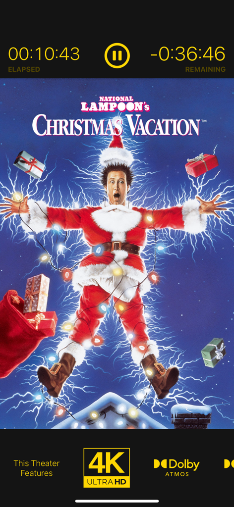 Now Showing – Movie Poster TV - Digital movie poster for National Lampoon's Christmas Vacation showing playback progress and 4K Dolby Atmos theater specs.