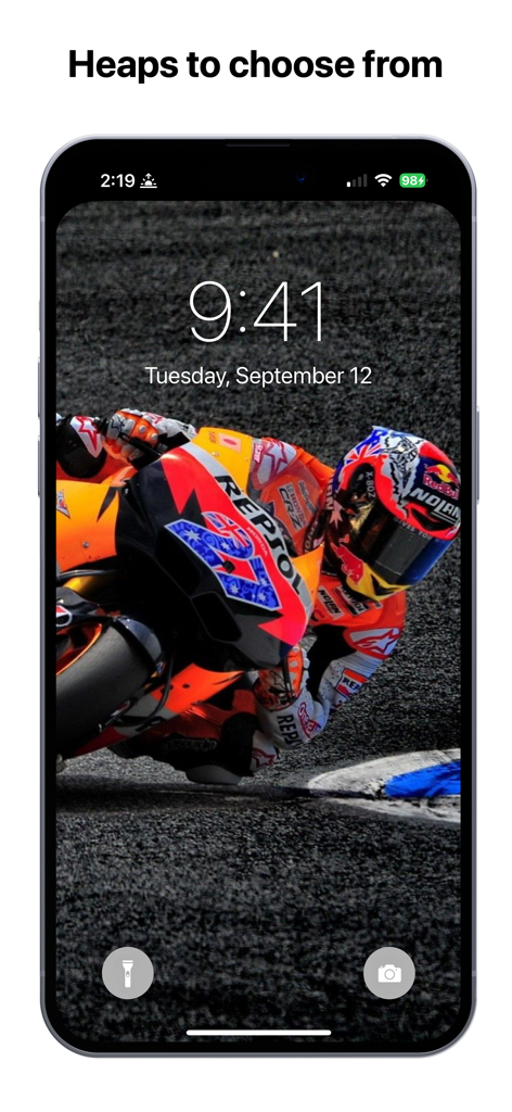 Moto GP Wallpapers 4K HQ Notch - MotoGP racer leaning on a track displayed as an iPhone lock screen wallpaper