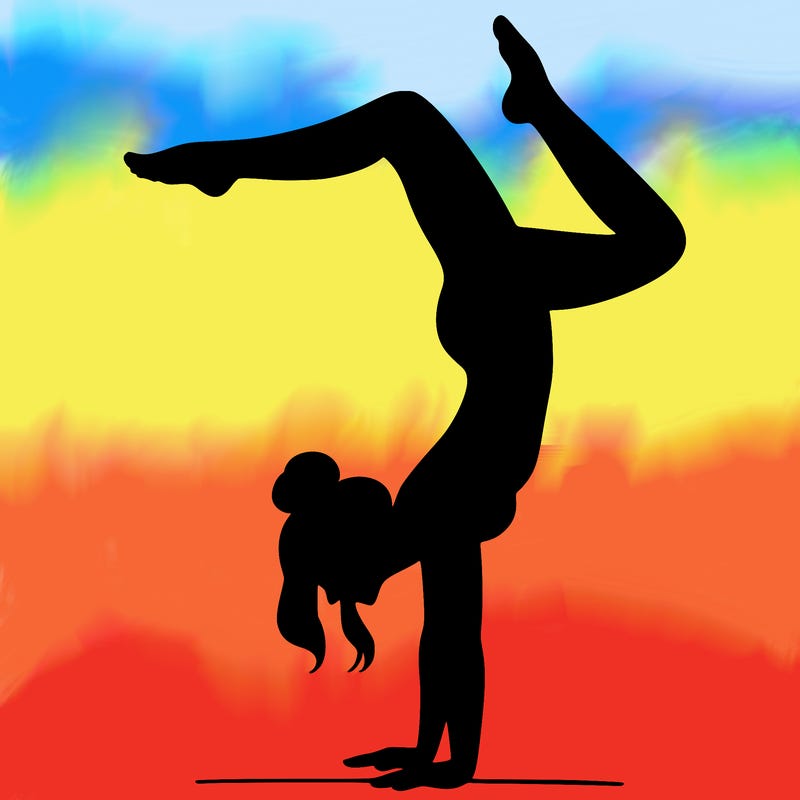 a woman doing a handstand
