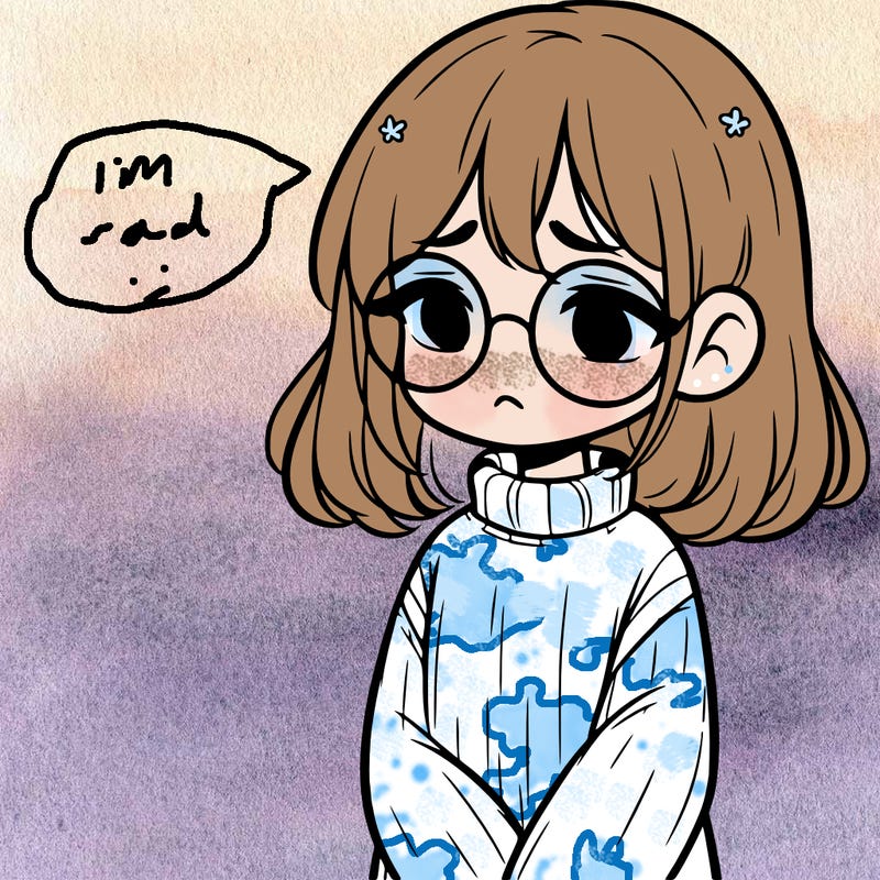 sad girl with glasses in a sweater