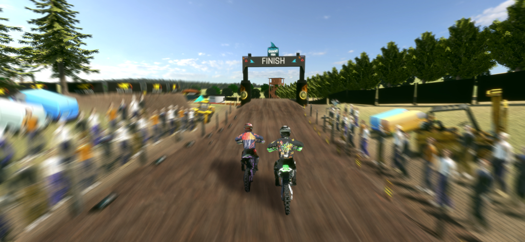Two motocross riders racing towards the finish line in a dirt bike game.