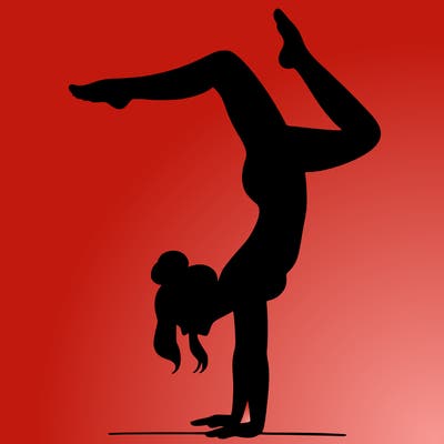 a woman doing a handstand
