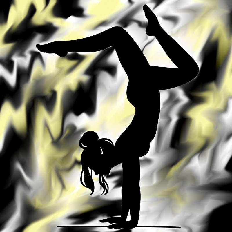 a woman doing a handstand