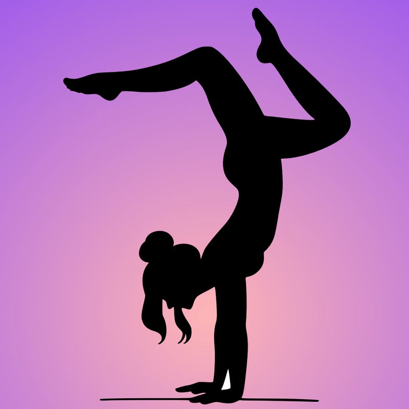 a woman doing a handstand