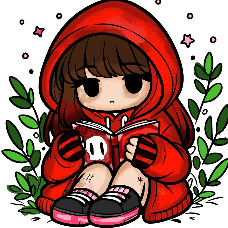 girl in oversized hoodie reading a book