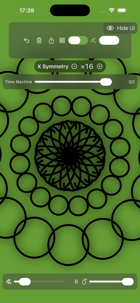 Mirror Drawing Studio - Mirror Drawing Studio app interface showing a black mandala pattern created with 16-way symmetry on a green canvas.
